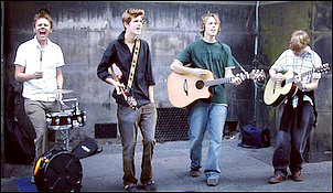 The LYs busking in the early days. Note former bassist Tom Mansfield on the right, who later mysteriously disappeared shortly before Tony premiered his new eco-friendly, organic drum-skins. You do the math.