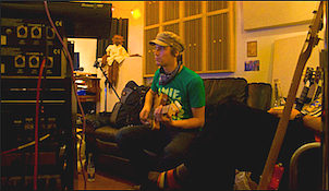 George in Andy's Chinatown studio, laying down guitars. You can tell he's in New York 'cos of his wicked hat.